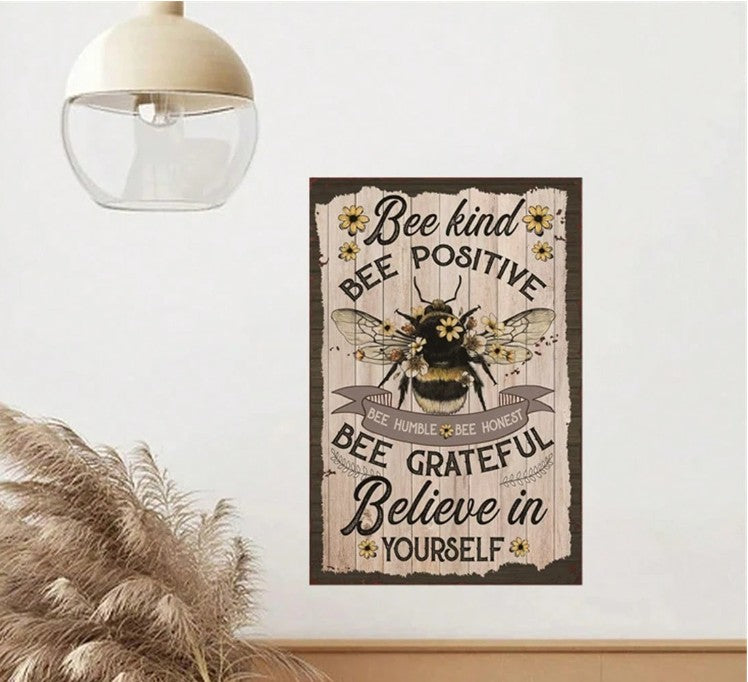 "Bee Metal Yard Art Sign with vintage rustic design featuring Bee Kind, Bee Positive, Bee Grateful affirmations"
"Inspirational bee-themed wall decor for garden or home, with uplifting messages in warm retro tones"
"Metal tin sign with pre-drilled holes for easy hanging, perfect for boho, spiritual, or zen spaces"
"Close-up of bee garden sign with affirmations in retro style for home or garden decoration"