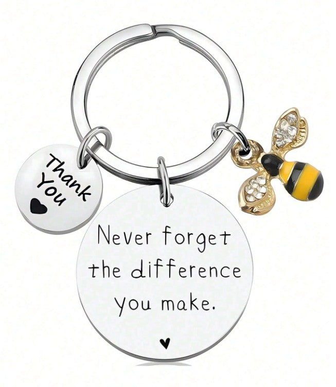 “Stainless steel engraved keychain with bee and heart charms”
“Inspirational quote keychain – Never forget the difference you make”
“Bee charm keyring appreciation gift for teachers, nurses, and friends”
“Durable keychain with motivational message and charm accents”