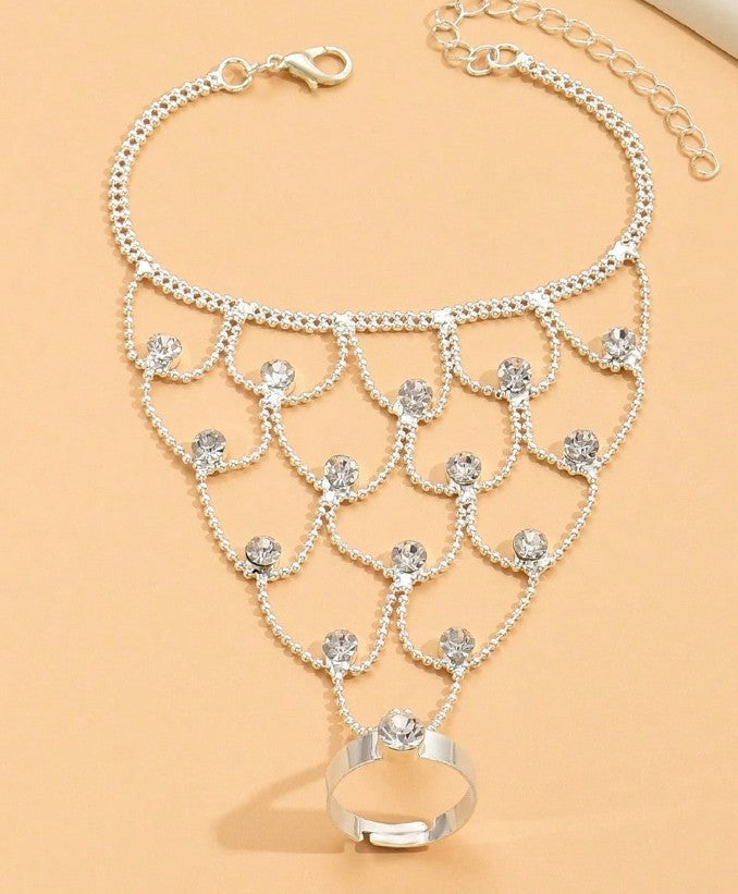 “Tassel and rhinestone hand chain bracelet connecting finger to wrist”
“Shiny finger-to-wrist bracelet with tassels and crystals”
“Boho glam rhinestone hand harness jewelry”
“Festival-style tassel bracelet with finger ring chain”