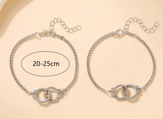 “Stainless steel handcuff couple bracelets with promise card”
“Matching handcuff charm bracelets for lovers or friends”
“Unique gift for couples or best friends with symbolic message”