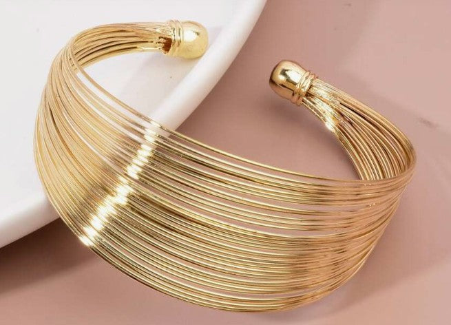 “Minimalist gold spiritual cuff bracelet for women”

“Adjustable gold bangle with modern spiritual design”

“Golden energy cuff inspired by mindfulness and clarity”

“Elegant lightweight bracelet with spiritual symbolism”

