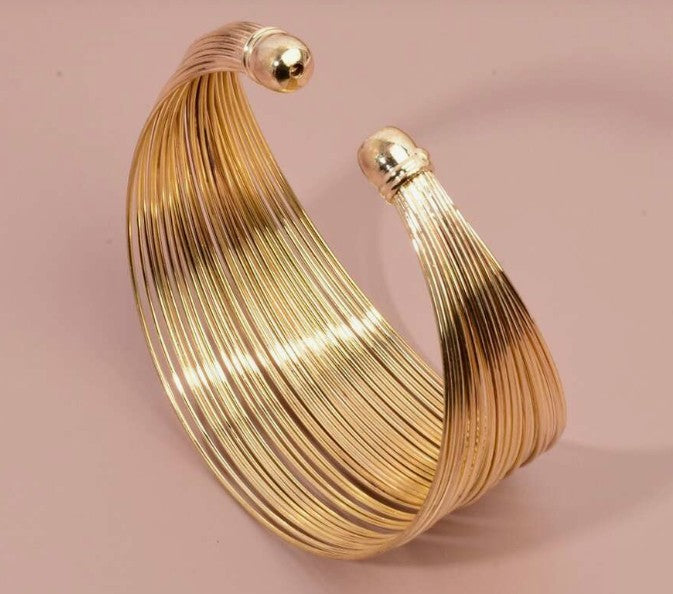“Minimalist gold spiritual cuff bracelet for women”

“Adjustable gold bangle with modern spiritual design”

“Golden energy cuff inspired by mindfulness and clarity”

“Elegant lightweight bracelet with spiritual symbolism”

