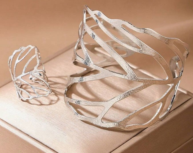 “Hollow leaf ring and bracelet set for women”

“Adjustable metal leaf jewelry set inspired by nature”

“2-piece open leaf jewelry set with bracelet and matching ring”

“Spiritual symbolic jewelry set in modern metal design”