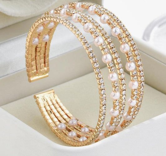 “5-tiered pearl and rhinestone bridal cuff bracelet”

“Elegant open bangle bracelet with pearls and sparkle”

“Minimalist bridal bracelet with faux pearls and rhinestones”

“Wedding day cuff for brides and spiritual elegance”