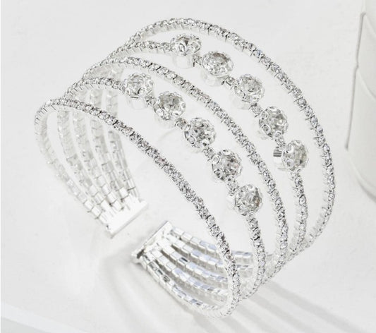 “Five-tier rhinestone cuff bracelet for weddings”

“Elegant open cuff with layered rhinestone bands”

“Bridal rhinestone bracelet with attached five-tier design”

“Glamorous bridal cuff with multi-layer sparkle”
