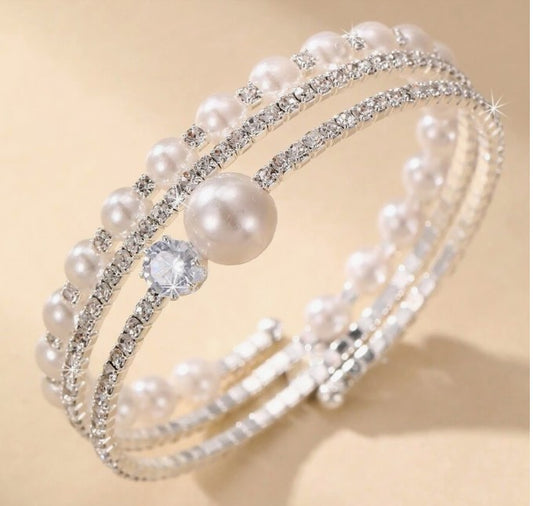“Dainty silver bangle bracelet with faux pearls and rhinestones”

“Elegant minimalist bracelet for weddings or daily wear”

“Lightweight silver-tone bracelet with pearl and sparkle accents”

“Subtle glam wedding bracelet with rhinestone detail”


