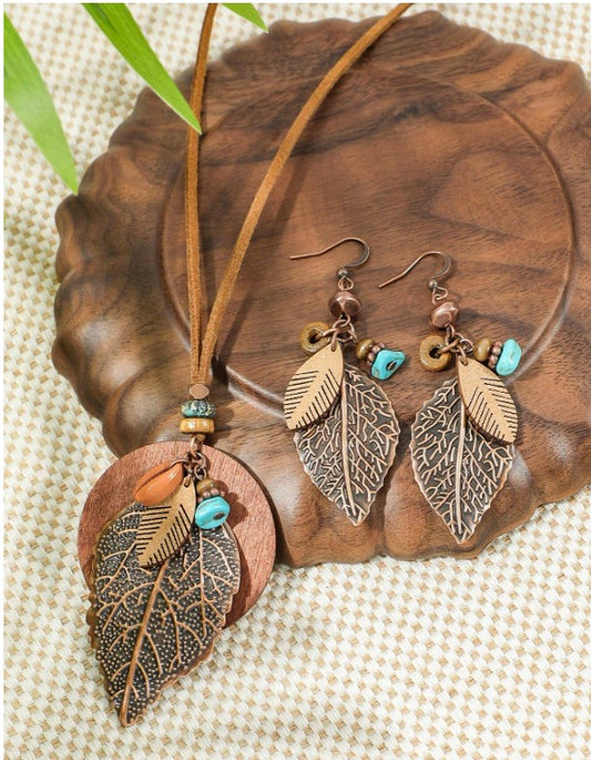 “Boho vintage jewelry set with leaf earrings and turquoise layered necklace”

“Geometric leaf-shaped metal earrings with boho layered pendant necklace”

“Wood bead, shell, and turquoise decor necklace with matching earrings”

“Nature-inspired bohemian jewelry set for women’s daily and festival wear”

