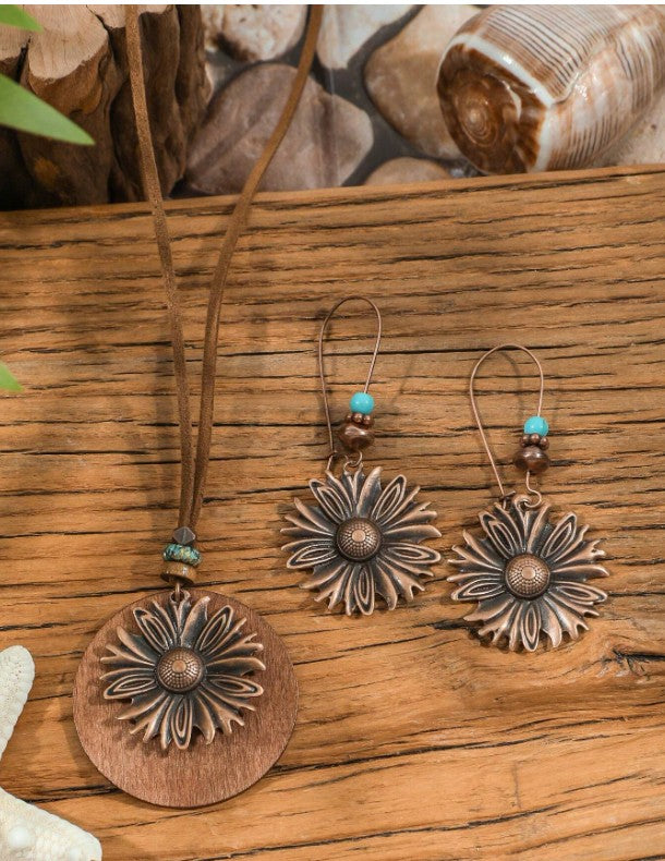 “Boho vintage jewelry set with sunflower pendant and asymmetrical earrings”

“Geometric circle dangle earrings and sunflower necklace in boho style”

“3-piece vintage style jewelry set for women’s daily and festival wear”

“Sunflower and geometric pendant jewelry set with artistic bohemian design”