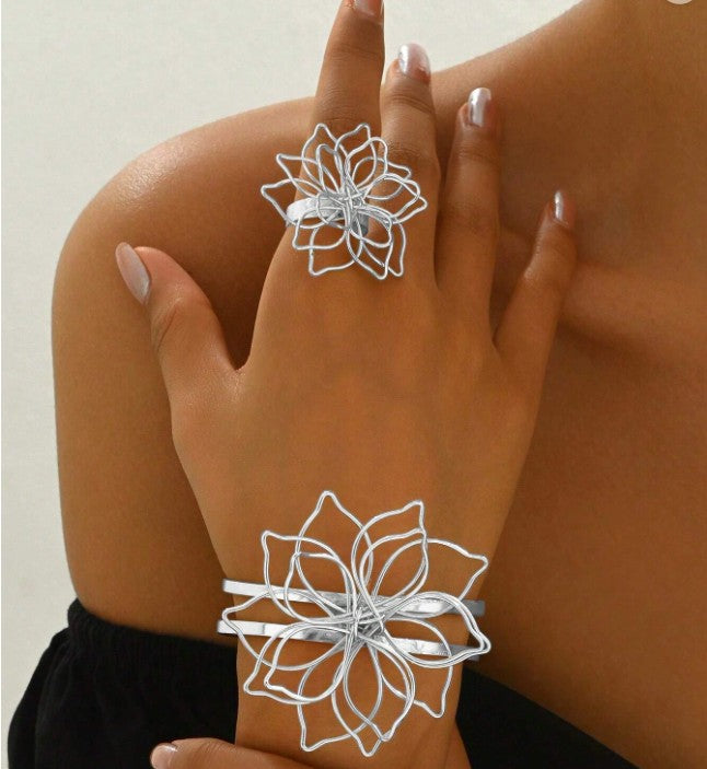 Floral wire design bracelet and ring set for women”

“Lightweight boho floral jewelry set with openwork wire design”

“Nature-inspired blooming grace jewelry set, bracelet and ring”

“Creative European and American style floral wire jewelry set”

