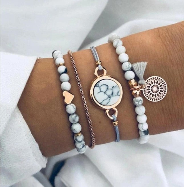 “4pcs tassel decor rhinestone bracelet set in white, gold, and grey”

“Stackable boho style rhinestone and tassel bracelet set for women”

“Multi-element layered bracelet set for daily wear and gifting”

“Elegant lightweight bohemian bracelets with rhinestones and tassels”