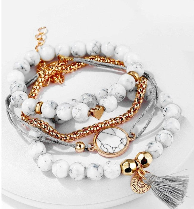 “4pcs tassel decor rhinestone bracelet set in white, gold, and grey”

“Stackable boho style rhinestone and tassel bracelet set for women”

“Multi-element layered bracelet set for daily wear and gifting”

“Elegant lightweight bohemian bracelets with rhinestones and tassels”