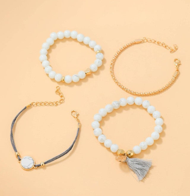 “4pcs tassel decor rhinestone bracelet set in white, gold, and grey”

“Stackable boho style rhinestone and tassel bracelet set for women”

“Multi-element layered bracelet set for daily wear and gifting”

“Elegant lightweight bohemian bracelets with rhinestones and tassels”