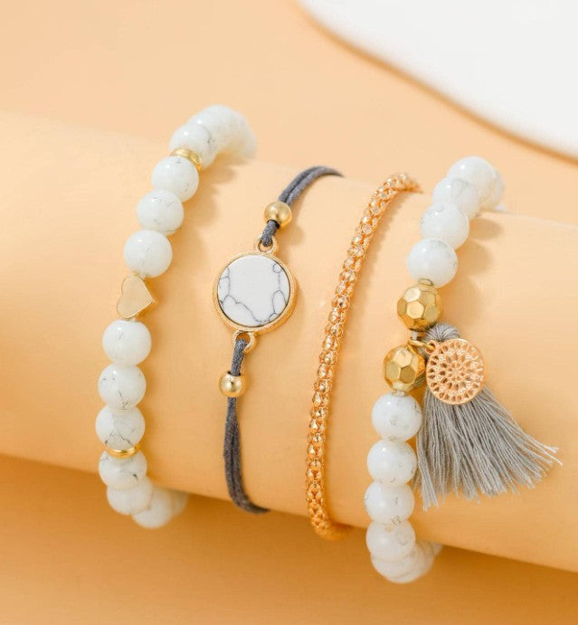 “4pcs tassel decor rhinestone bracelet set in white, gold, and grey”

“Stackable boho style rhinestone and tassel bracelet set for women”

“Multi-element layered bracelet set for daily wear and gifting”

“Elegant lightweight bohemian bracelets with rhinestones and tassels”