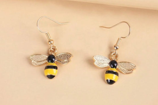 “Gold-tone dangling bee earrings with hook backs, 1.5 inch drop”

“Lightweight nature-inspired bee earrings for women”

“Dangling bee charm earrings from Christie Bella Bee Loved Collection”

“Boho bee drop earrings with spiritual symbolism”