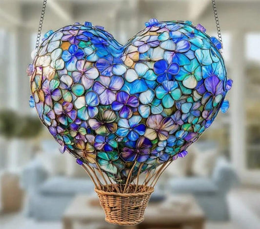 Whimsical heart and floral hot air balloon sun catcher hanging in window”

“8x8 inch light-catching home decor with heart and flower design”

“Hanging sun catcher with hot air balloon shape for boho and spiritual decor”