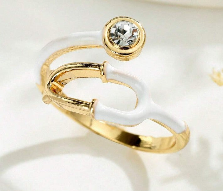 “Adjustable stethoscope-inspired fashion ring for nurses and doctors”

“Silver medical symbol ring for healthcare professionals”

“Heart & Soul Collection stethoscope jewelry piece”


