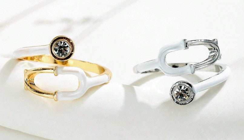 “Adjustable stethoscope-inspired fashion ring for nurses and doctors”

“Silver medical symbol ring for healthcare professionals”

“Heart & Soul Collection stethoscope jewelry piece”

