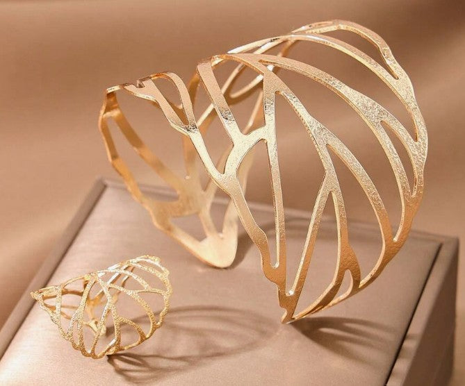 “Hollow leaf ring and bracelet set for women”

“Adjustable metal leaf jewelry set inspired by nature”

“2-piece open leaf jewelry set with bracelet and matching ring”

“Spiritual symbolic jewelry set in modern metal design”